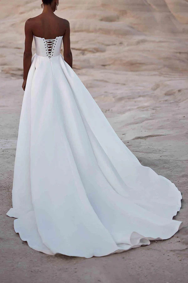 A white satin wedding dress with palace train lines and no shoulder straps Sexy
