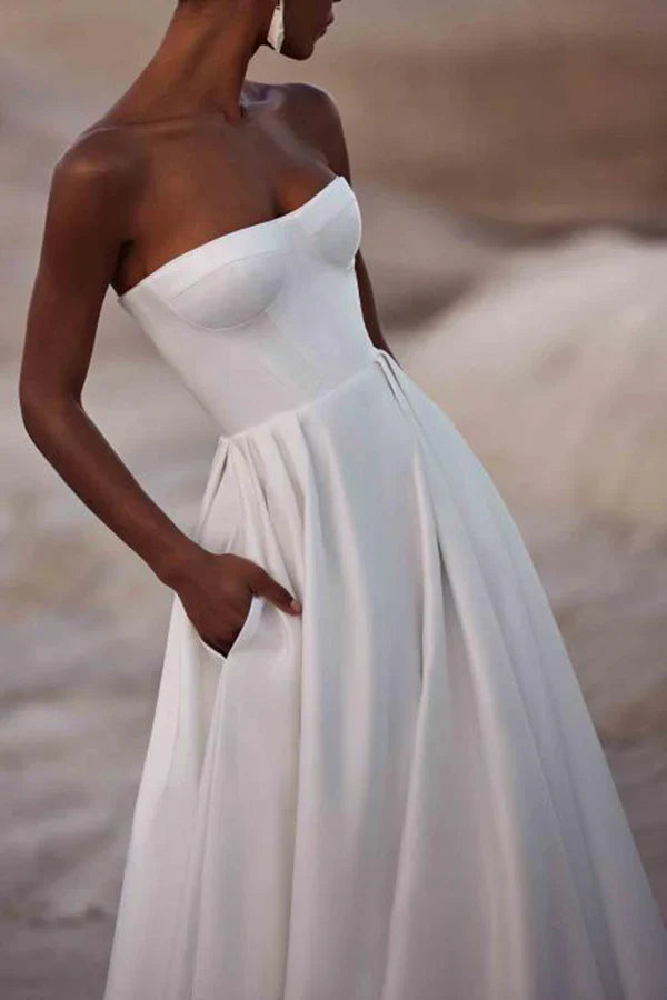 A white satin wedding dress with palace train lines and no shoulder straps Sexy