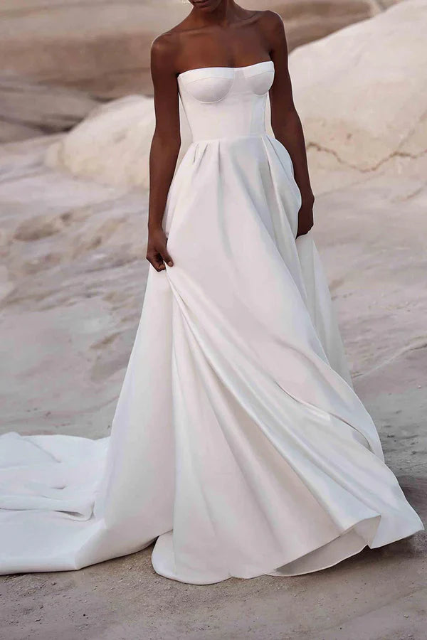 A white satin wedding dress with palace train lines and no shoulder straps Sexy